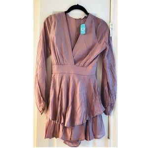 Romper long sleeve new with tags. Size Small